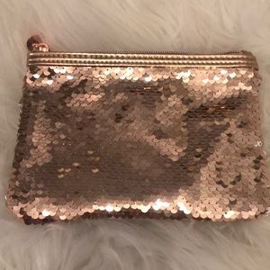 Macy’s rose gold and white sequin pouch